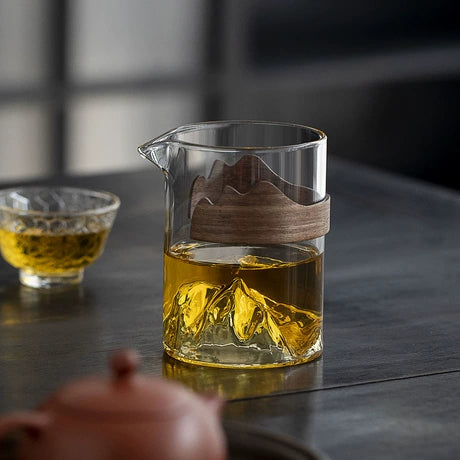 Glass Tea Pitcher with Mountain Motif & Wooden Grip